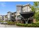 Modern building with neutral tones, balconies and lush landscaping for a contemporary feel at 515 N Churton St # 203, Hillsborough, NC 27278