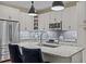 Contemporary kitchen featuring granite countertops, stainless steel appliances, and pendant lighting over the island at 515 N Churton St # 203, Hillsborough, NC 27278