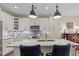 Contemporary kitchen featuring granite countertops, stainless steel appliances, and pendant lighting over the island at 515 N Churton St # 203, Hillsborough, NC 27278