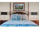 Detailed view of the bed in the main bedroom featuring designer pillows and classic decor at 515 N Churton St # 203, Hillsborough, NC 27278