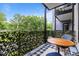 Relaxing patio with blue and white checkered rug and decorative privacy screen at 515 N Churton St # 203, Hillsborough, NC 27278