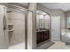 Bathroom featuring a tiled shower, granite vanity, and relaxing bathtub at 5321 Cambridgeshire Loop, Cary, NC 27519