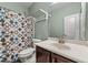 Bathroom featuring a single sink vanity and shower with a patterned curtain at 5321 Cambridgeshire Loop, Cary, NC 27519