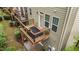 View of wood deck with black railings, seating, and outdoor living space at 5321 Cambridgeshire Loop, Cary, NC 27519