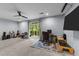 Spacious flex room featuring a desk, entertainment center, and sliding glass door at 5321 Cambridgeshire Loop, Cary, NC 27519