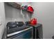 Laundry room featuring modern washer and dryer with convenient shelving at 5321 Cambridgeshire Loop, Cary, NC 27519