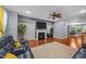 Inviting living room with fireplace, hardwood floors, and a view to the dining area at 5321 Cambridgeshire Loop, Cary, NC 27519