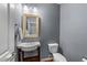 Charming powder room with updated fixtures and decorative mirror at 5321 Cambridgeshire Loop, Cary, NC 27519