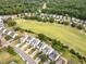 Aerial view of the community with lush green lawn and mature trees at 5512 Grand Traverse Dr, Raleigh, NC 27604