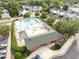 Aerial view of community pool and rec center with parking and amenities at 5512 Grand Traverse Dr, Raleigh, NC 27604