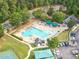 Aerial view of community pool with plenty of chairs and umbrellas for residents at 5512 Grand Traverse Dr, Raleigh, NC 27604