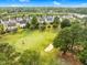 Scenic aerial view of the community's golf course and the surrounding neighborhood at 5512 Grand Traverse Dr, Raleigh, NC 27604