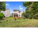 Spacious backyard featuring a wooden screened-in porch and mature landscaping at 5512 Grand Traverse Dr, Raleigh, NC 27604