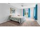 Bright bedroom with neutral walls, carpet floors, and a ceiling fan at 5512 Grand Traverse Dr, Raleigh, NC 27604