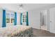 Bedroom with three windows that provide natural light, and a ceiling fan at 5512 Grand Traverse Dr, Raleigh, NC 27604
