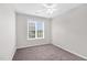 An empty bedroom featuring a ceiling fan and window at 5512 Grand Traverse Dr, Raleigh, NC 27604
