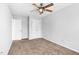 Bedroom with a ceiling fan, carpet floors, and closet at 5512 Grand Traverse Dr, Raleigh, NC 27604