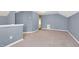 Bonus room featuring carpet, neutral paint, and a door leading to the outside at 5512 Grand Traverse Dr, Raleigh, NC 27604