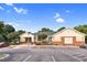 View of clubhouse with parking lot and landscaping on a clear day at 5512 Grand Traverse Dr, Raleigh, NC 27604