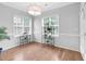 Bright dining room featuring large windows and elegant chandelier lighting at 5512 Grand Traverse Dr, Raleigh, NC 27604