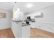 Modern kitchen with white cabinets, granite countertops, and stainless steel appliances at 5512 Grand Traverse Dr, Raleigh, NC 27604