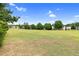 Spacious green lawn with mature trees and landscaping at 5512 Grand Traverse Dr, Raleigh, NC 27604