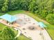Aerial view of shaded playground featuring playground equipment and benches at 5512 Grand Traverse Dr, Raleigh, NC 27604