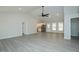 Spacious living room with gray flooring, recessed lighting, and kitchen view at 5576 Foothills Ct, Snow Camp, NC 27349