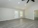 Bright living room featuring gray flooring and a white front door at 5576 Foothills Ct, Snow Camp, NC 27349