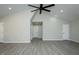 Spacious living room featuring vaulted ceilings, gray flooring, and recessed lighting at 5576 Foothills Ct, Snow Camp, NC 27349