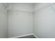A walk-in closet is equipped with metal shelves for organization and storage at 5576 Foothills Ct, Snow Camp, NC 27349