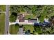 The backyard includes a private area, spacious driveway, additional buildings, and lush surrounding trees at 5820 Wake Forest Hwy, Durham, NC 27703