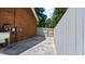 Side yard with concrete pad and partial fence at 5820 Wake Forest Hwy, Durham, NC 27703