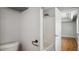 Bathroom featuring shower, toilet, neutral color, copper fixtures, and entry to adjacent bedroom at 5820 Wake Forest Hwy, Durham, NC 27703