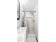 Close up view of a bathroom shower with white tile and a rainfall shower head at 5820 Wake Forest Hwy, Durham, NC 27703