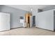View of a bathroom with tile floors, blue walls, and a white door to the left at 5820 Wake Forest Hwy, Durham, NC 27703