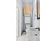 A bathroom featuring a toilet, sink, and storage cabinets with neutral walls and tile flooring at 5820 Wake Forest Hwy, Durham, NC 27703