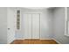 An inviting bedroom featuring ample closet space, built-in shelving, and a window for natural light at 5820 Wake Forest Hwy, Durham, NC 27703