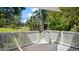 Outdoor deck area surrounded by lush greenery, perfect for relaxing or entertaining guests at 5820 Wake Forest Hwy, Durham, NC 27703