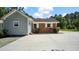 Rear exterior of the home showing architectural features and convenient driveway access at 5820 Wake Forest Hwy, Durham, NC 27703