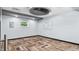 Spacious flex room with unique flooring, recessed lighting, and a modern ceiling design at 5820 Wake Forest Hwy, Durham, NC 27703