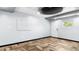 Light flex room with herringbone floors, a modern ceiling, and a calendar on the wall at 5820 Wake Forest Hwy, Durham, NC 27703
