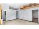 Large flex space with tile floor, a drop-down ceiling light, and built in storage, ready for your design at 5820 Wake Forest Hwy, Durham, NC 27703