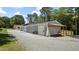 Large garage and carport area, perfect for storing vehicles and equipment with easy access from the driveway at 5820 Wake Forest Hwy, Durham, NC 27703