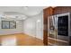 Kitchen and living room featuring stainless steel appliances and hardwood floors at 5820 Wake Forest Hwy, Durham, NC 27703