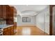 Bright and airy living space featuring wood floors, tray ceilings, and views of the outdoors through a large window at 5820 Wake Forest Hwy, Durham, NC 27703