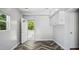 A convenient mudroom featuring stylish floors, cabinetry, and access to the outdoors at 5820 Wake Forest Hwy, Durham, NC 27703