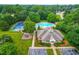 Aerial view of community amenities: clubhouse, tennis court, and swimming pool at 6005 Carlyle Dr, Raleigh, NC 27614