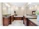 Elegant bathroom with dual sinks, granite counters, fireplace, and a soaking tub at 6005 Carlyle Dr, Raleigh, NC 27614
