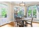 A breakfast nook with natural light, fireplace, and a dining table that seats four at 6005 Carlyle Dr, Raleigh, NC 27614